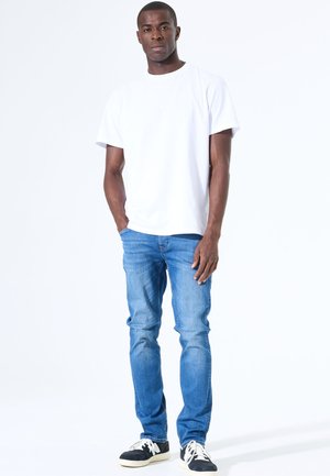 TAPERED FIT - Jeans fuselé - medium used