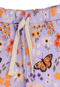 Light purple fabric with floral and butterfly patterns. Elastic waistband with a cream drawstring. Features various flower designs in multiple colors.