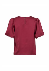Blouse marron avec manches bouffantes et encolure ronde. Dotée d'une petite fermeture à bouton avec ouverture en forme de trou de serrure à l'arrière. Texture lisse et satinée.