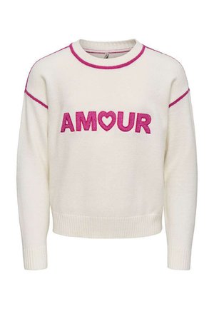 Pull en maille crème avec bordure rose et texte « AMOUR » en rose, avec une forme de cœur remplaçant la lettre « O » sur la poitrine.
