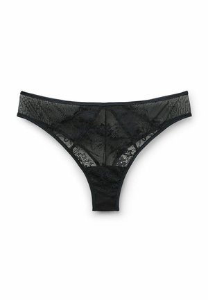 String en dentelle noire avec un devant en mesh transparent, motifs floraux et une taille élastique lisse. L'arrière est minimal sans accents supplémentaires.