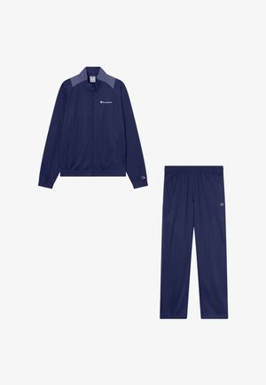 Chándal Champion azul marino con chaqueta con cremallera y logo en el pecho, y pantalones con cintura elástica y logo en el muslo.