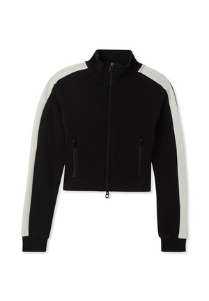 Giacca nera corta con zip, caratterizzata da pannelli laterali bianchi, due tasche frontali con zip, polsini a coste e colletto alto. Realizzata in un materiale morbido.