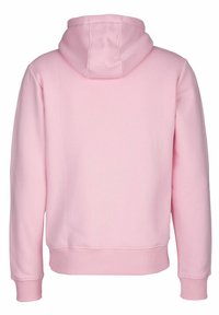 Růžová mikina s měkkou texturou, přední kapsou, žebrovanými manžetami a kapucí na šňůrku. Na zadní straně se nachází jednoduchý, beze švů design.