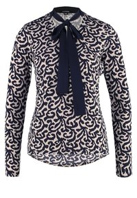 Bluse med lange ærmer og abstrakt mønster i marineblå og beige, med en marineblå sløjfe ved kraven og afrundet kant.