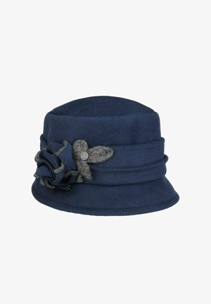 Navy blue wool cloche hat with a folded brim and decorative flower with gray accents and a small round metal emblem on the side.