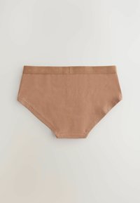 Slip in cotone beige con una texture liscia, caratterizzato da una cintura elastica a contrasto con il logo "NEXT" ripetuto. Design hipster classico.