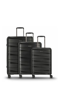 Trois valises rigides noires de tailles petite, moyenne et grande, avec des poignées télescopiques et quatre roulettes multidirectionnelles chacune.