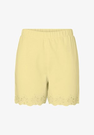 Lysegule dameshorts med elastisk talje og bølget kant med blomsterbroderi med hulmønster.