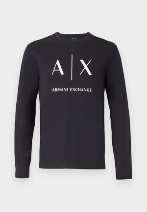 Must pikkade varrukatega T-särk, millel on ees valge "A | X" logo ja "ARMANI EXCHANGE" tekst keskel.