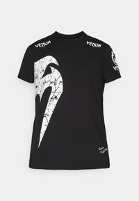 Črna bombažna majica s kratkimi rokavi, ki na sprednji strani vsebuje veliko belo razpokana grafiko, Venum logotip na ramenih in majhen logotip na robu.