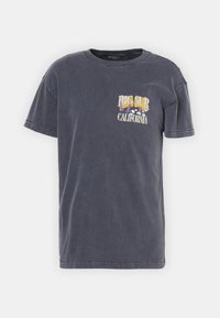 Gray cotton t-shirt with a crew neckline and short sleeves. Features front embroidery saying "BIG SUR CALIFORNIA." Soft texture, casual fit.