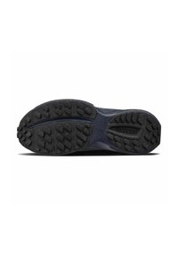 Semelle de chaussure en caoutchouc noir avec un motif de traction multidirectionnel, présentant un design texturé et une zone lisse pour la flexibilité.