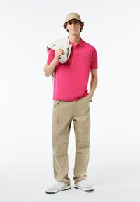 Lacoste Piké - rose fushia sqi