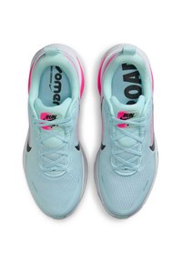 Light blue running shoes with a textured mesh upper, black accents, and bright pink details. Features flat laces and a cushioned sole.