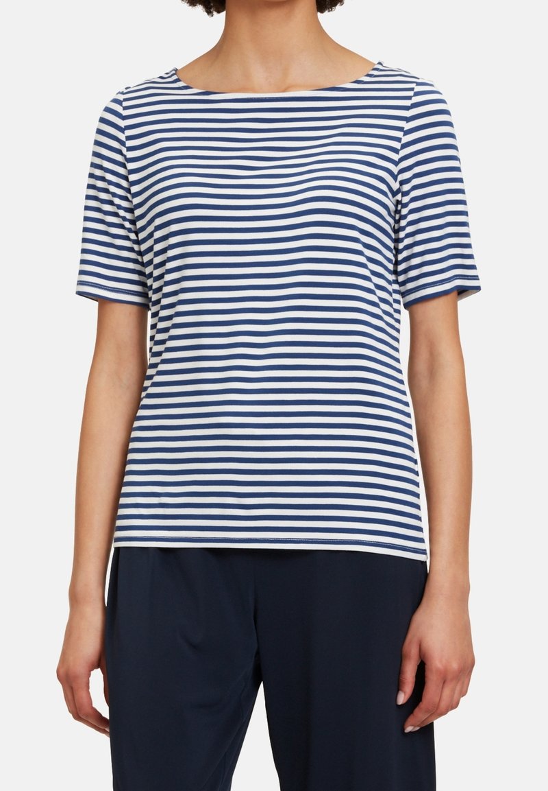 Marinblå och vitrandig t-shirt med kort ärm, rund halsringning, mjukt tyg, avslappnad passform, sömlösa manschetter och fåll i midjelängd.