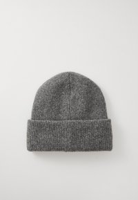 Hallide hallide beanie, mis on valmistatud pehmest villast, kumera küljega ja ribakujundusega. Ümar ülemine osa ja saumiksuta disain.