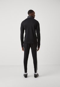 adidas Performance TIRO 24 WINTERIZED - Sportska majica - black/shock red