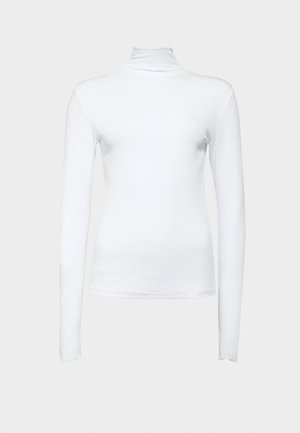 Vit långärmad polotröja i stretchigt bomullstyg. Har en figurnära design och slät yta, utan synliga mönster eller accenter.