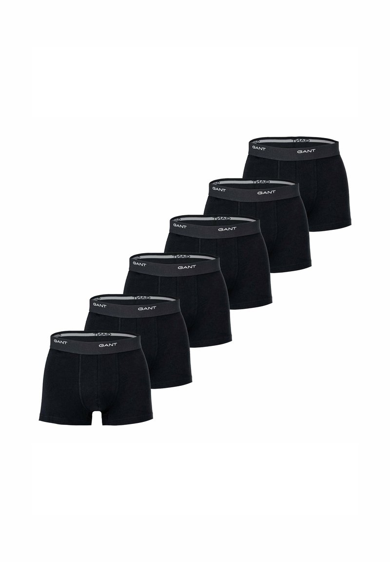 Black boxer shorts made of soft fabric, featuring a gray elastic waistband with the brand name. Set of six displayed in a row.