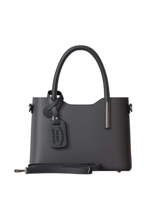 Gray leather handbag with a structured design, slim top handles, a detachable strap, and a tag detailing craftsmanship and materials.
