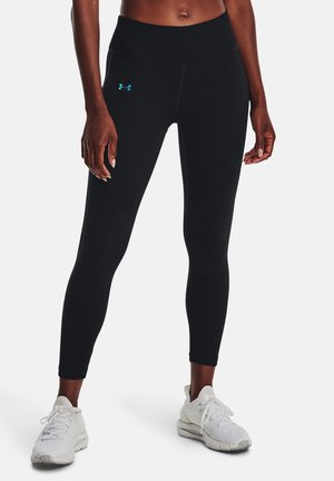Leggings sportivi neri con texture a coste e logo turchese a contrasto, dotati di una fascia alta in vita e design aderente.