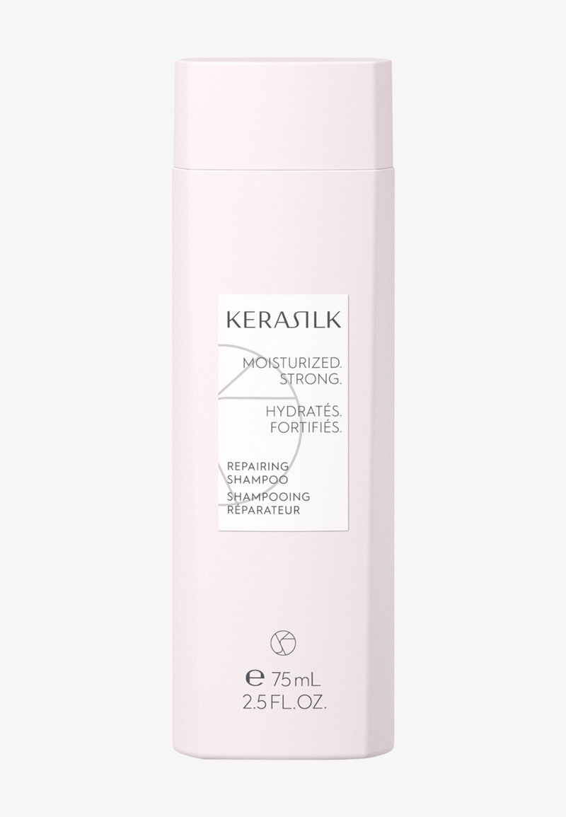 Flacon de shampooing réparateur Kerasilk, rose clair, 75 ml, étiqueté "moisturized, strong" en anglais et en français.