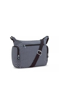 Zippered crossbody bag in navy and white geometric pattern. Features adjustable strap, exterior pocket, and textured fabric.
