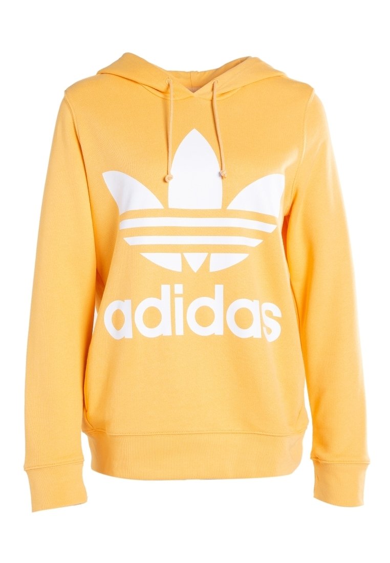 Gul bomulls-hoodie med en vit Adidas-logotyp och tre parallella ränder nedanför. Har en kanguruficka och huva med dragsko.