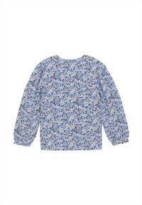 Langermet bluse laget av lett stoff med et blått blomstermønster på en lys bakgrunn. Rund halslinning og innsamlede ermer.