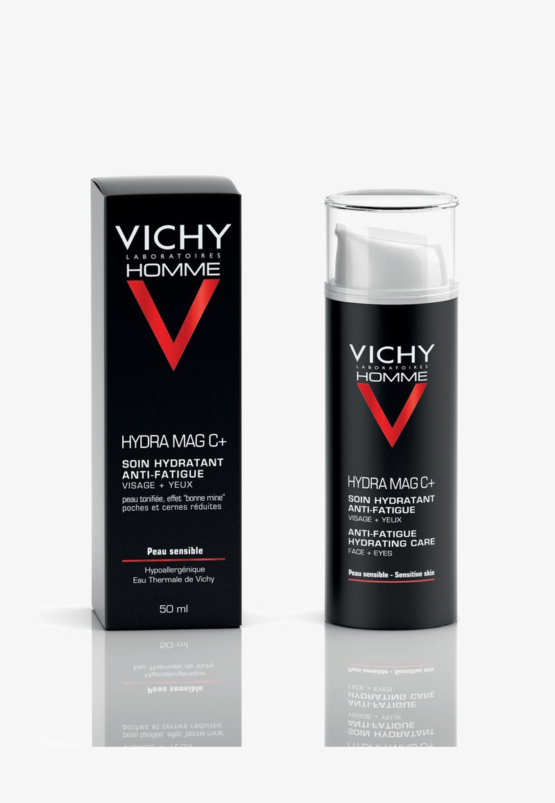 Black and silver packaging of Vichy Hydra Mag C+ anti-fatigue cream, featuring a transparent pump dispenser and bold text labels. 50 ml.