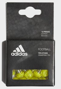 Imballaggio nero per tacchetti TPU Adidas, con 12 tacchetti gialli brillanti visibili attraverso una finestra trasparente, con specifiche di prodotto dettagliate stampate.
