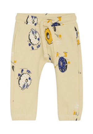 Lichtbeige sweatpants met speelse patronen van dieren en voedsel. Voorzien van een elastische tailleband met een trekkoord, zijzakken en omgeslagen enkels.