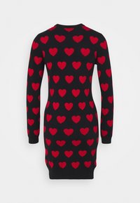 Robe noire ajustée à manches longues avec un motif de cœurs rouges réparti uniformément sur le tissu.