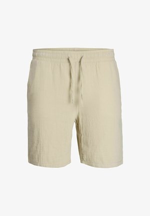 Beige træk- og slipshorts lavet af letvægtsstof, med et struktureret mønster og en elastisk talje for komfort.