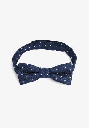 Punto di cravatta strutturato blu navy con pois bianchi, dotato di una fascia regolabile per una vestibilità sicura e una forma a farfalla ben definita.
