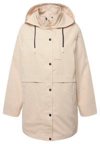 Giacca parka impermeabile beige con cappuccio ampio, cordoncini neri, chiusura frontale a pressione e due grandi tasche frontali.