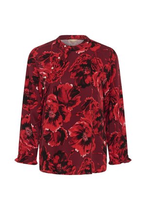 Rote Bluse mit langen Ärmeln, großem schwarz-rotem Blumenmuster, Perlenknopfdetails und Rüschensaum an der Vorderseite und an den Manschetten.