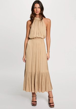 Beige halter maxi dress with gathered bodice and tiered ruffle hem, made of soft material, featuring a fitted waist and flowing skirt.