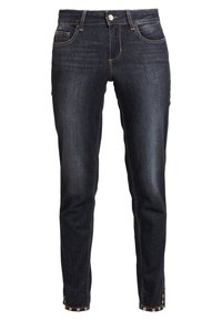 Dark blue denim jeans with a slim fit, five pockets, and gold-tone button accents at the hem. Features subtle fading and stitching details.