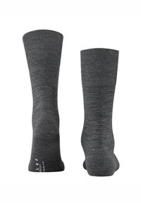 Grå sokker til midt på læggen med ribbet øverste kant og glat tekstur. Har forstærket tå og hæl for holdbarhed. Mærkeetiket på sålen.