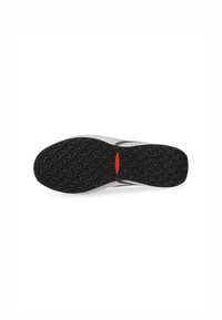 Black rubber outsole with a wave pattern, white midsole, and a small red logo near the heel. The design is functional and streamlined.