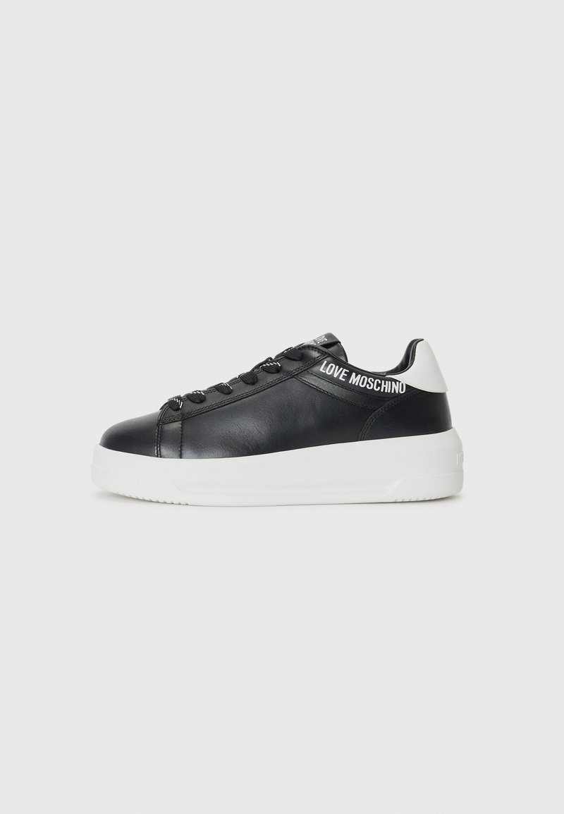 Black low-top sneaker with white sole and heel, black laces, and "LOVE MOSCHINO" text on side stripe and tongue.