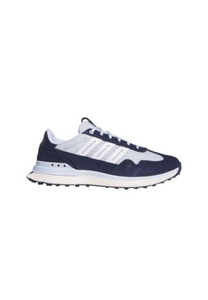 Sneaker bassa blu e bianca con strisce bianche, chiusura con lacci e suola testurizzata su sfondo bianco semplice.