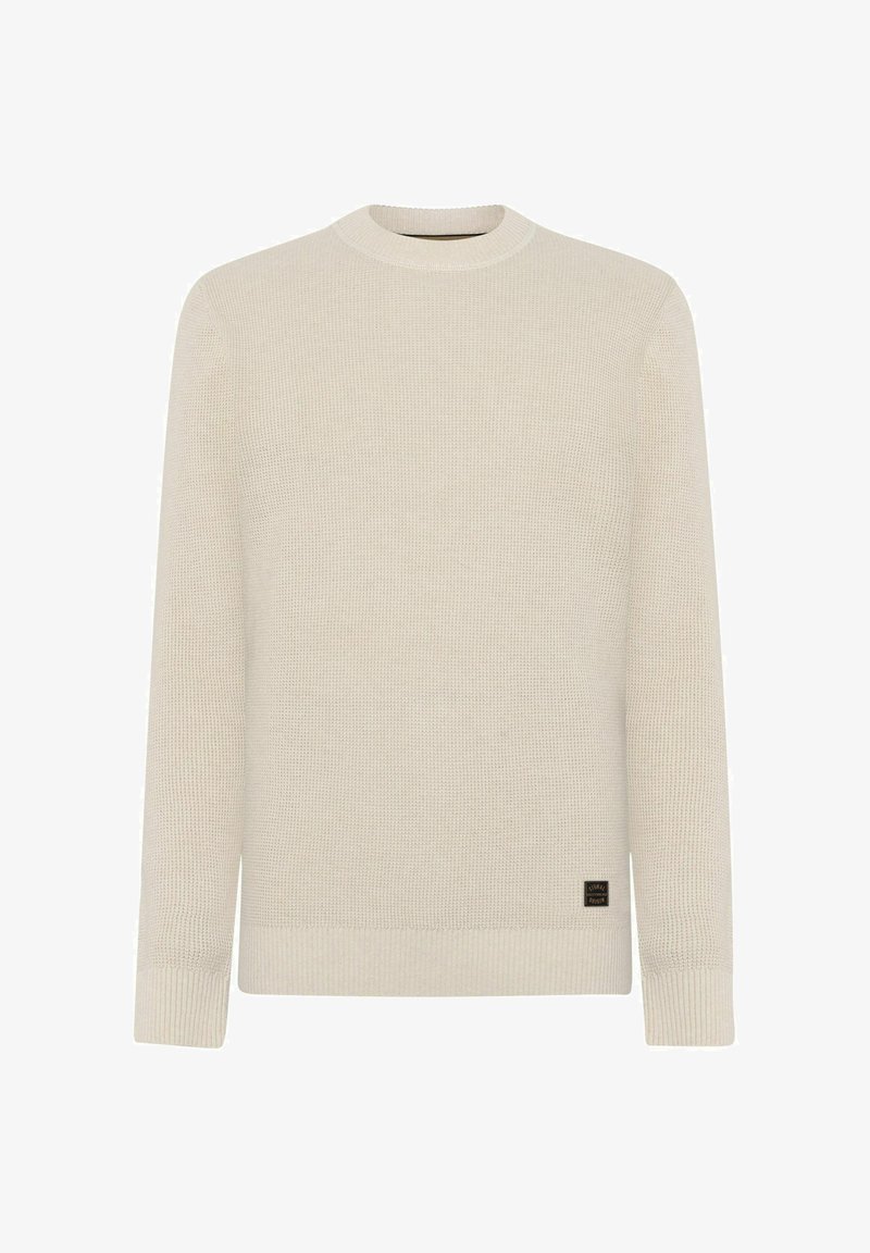 Maglione beige in maglia con maniche lunghe, polsini e orlo a coste, scollatura a girocollo e piccolo marchio nero e marrone vicino all'orlo inferiore.