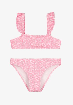 Bikini de dos piezas rosa con patrón de corazones blancos y puntos, con tirantes con volantes en la parte superior y parte inferior de corte estándar.