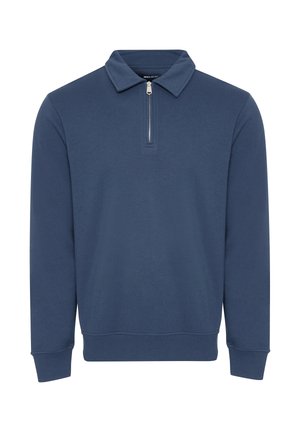 Navyblauwe pullover met een ritssluiting kraag, lange mouwen en geribde manchetten en zoom. Gemaakt van een zachte, lichte stof met een gladde textuur.