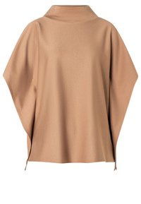 Light brown oversized top with a stand collar, made of textured fabric, featuring wide sleeves and subtle side slits for comfort.