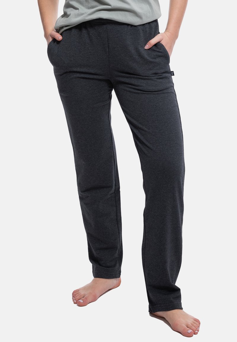 Pantaloni jogger grigio scuro realizzati in tessuto morbido, con tasche laterali e una cintura elastica per il massimo comfort. Design a gamba dritta con texture minima.