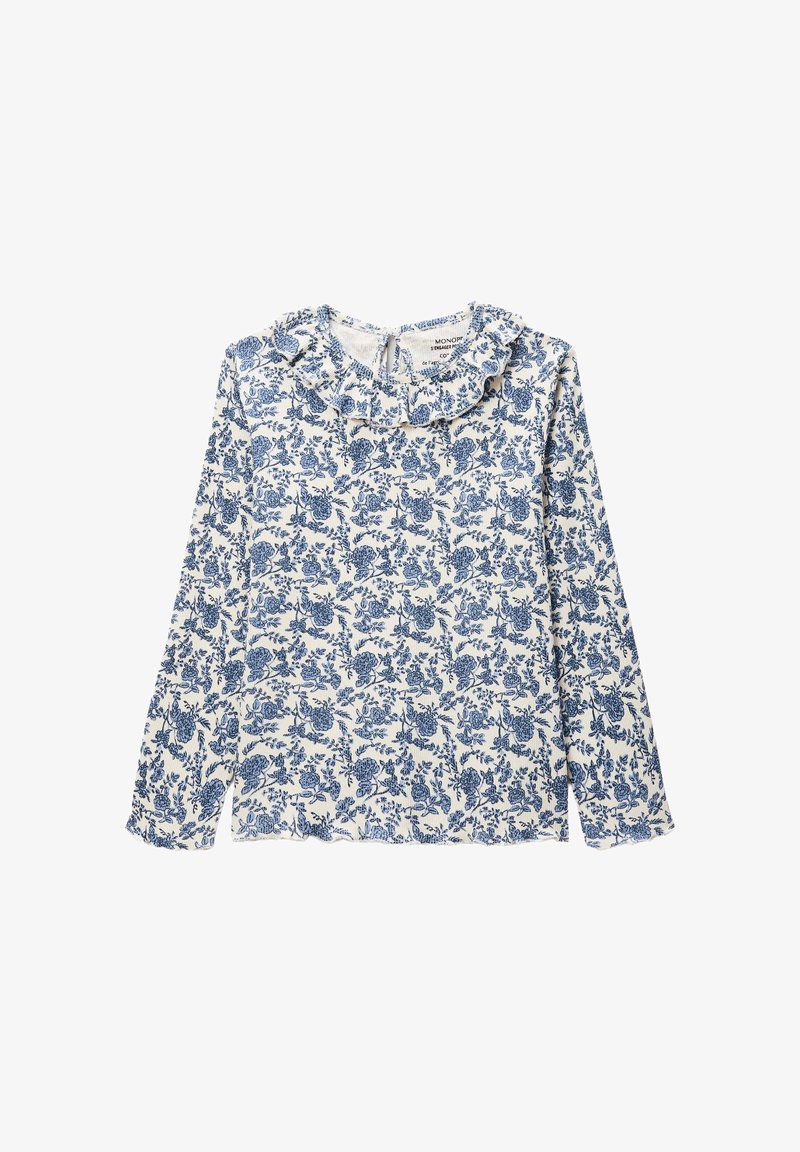 Blouse à manches longues en tissu blanc, ornée d'un motif floral bleu, avec un col froncé et une ouverture en keyhole au dos. Texture douce.